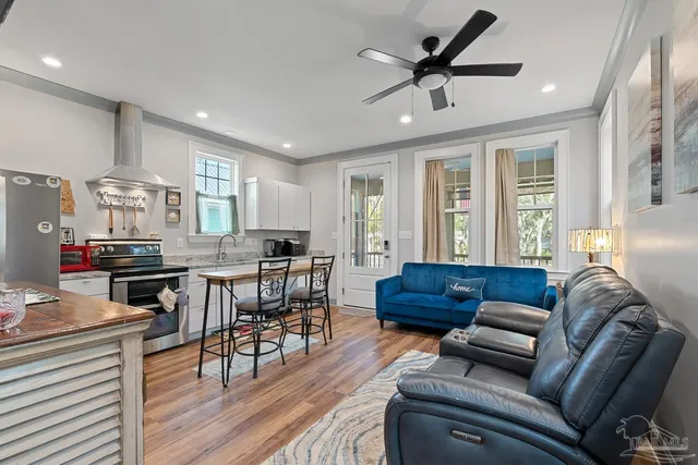 a kitchen with stainless steel appliances granite countertop a sink and cabinets