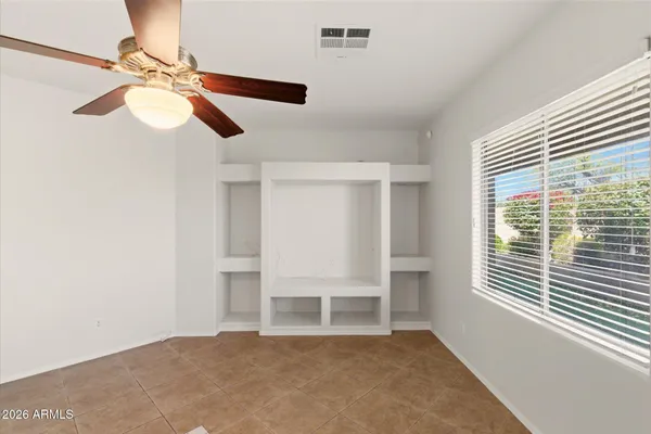 a view of an empty room with a window