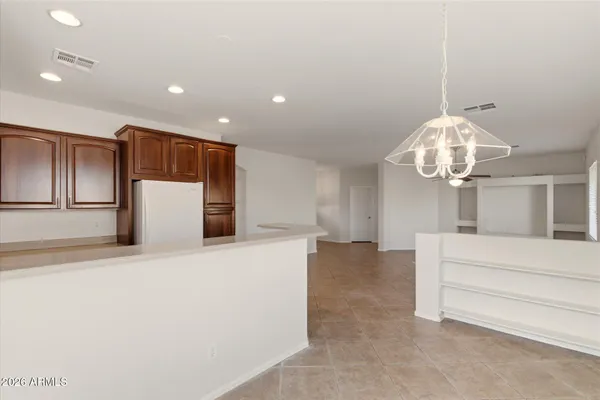 a kitchen with wooden cabinets and a sink