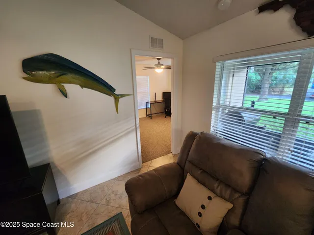 a living room with furniture and a window