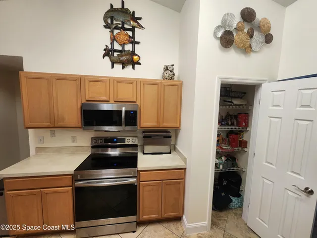 a kitchen with a sink and a stove top oven
