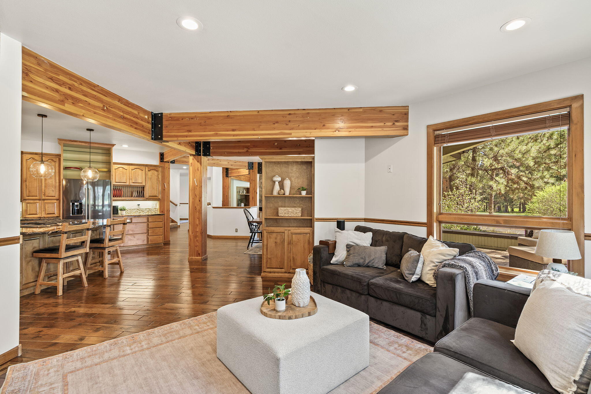 60766 Golf Village Loop Bend, OR 97702 - Photo 12 of 63 a living room with furniture and a large window