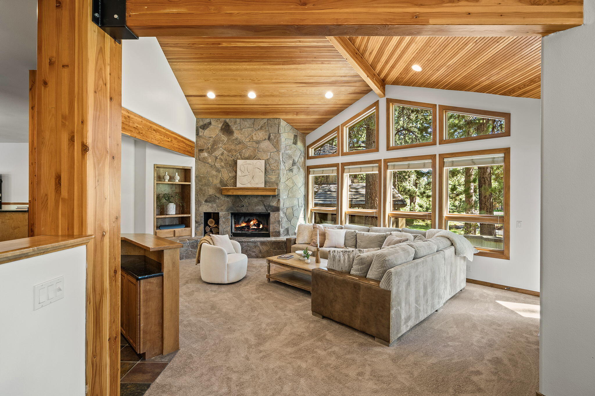 60766 Golf Village Loop Bend, OR 97702 - Photo 15 of 63 a living room with furniture and a fireplace