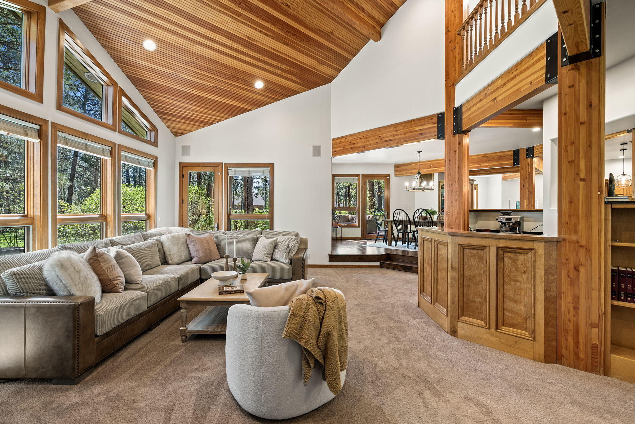 60766 Golf Village Loop Bend, OR 97702 - Photo 16 of 63 a living room with furniture and large windows
