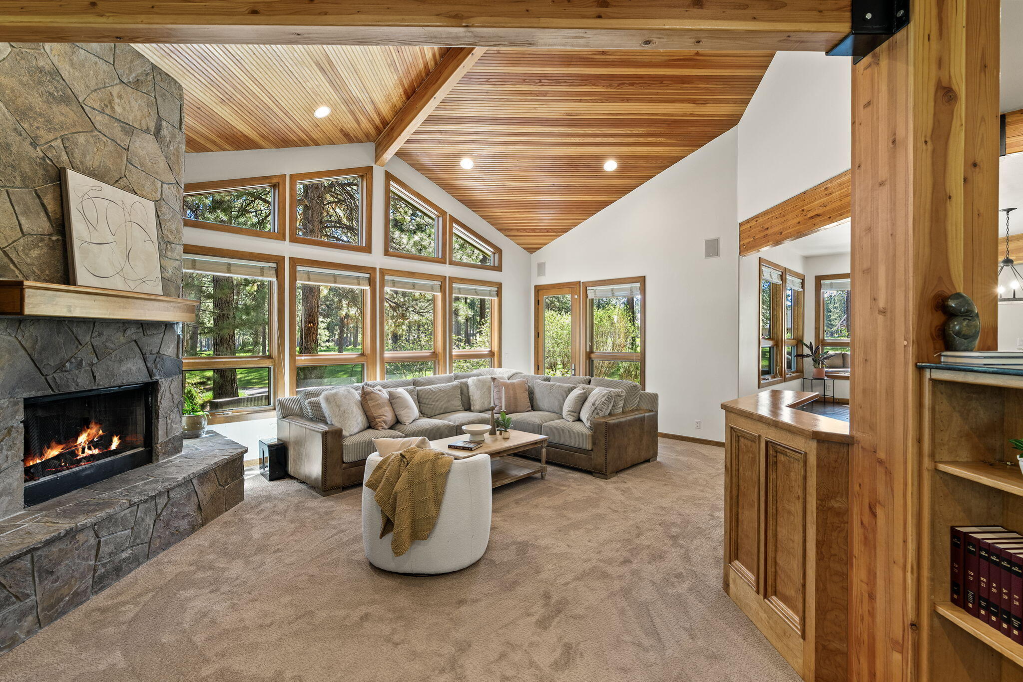 60766 Golf Village Loop Bend, OR 97702 - Photo 20 of 63 a living room with furniture a fireplace and a large window
