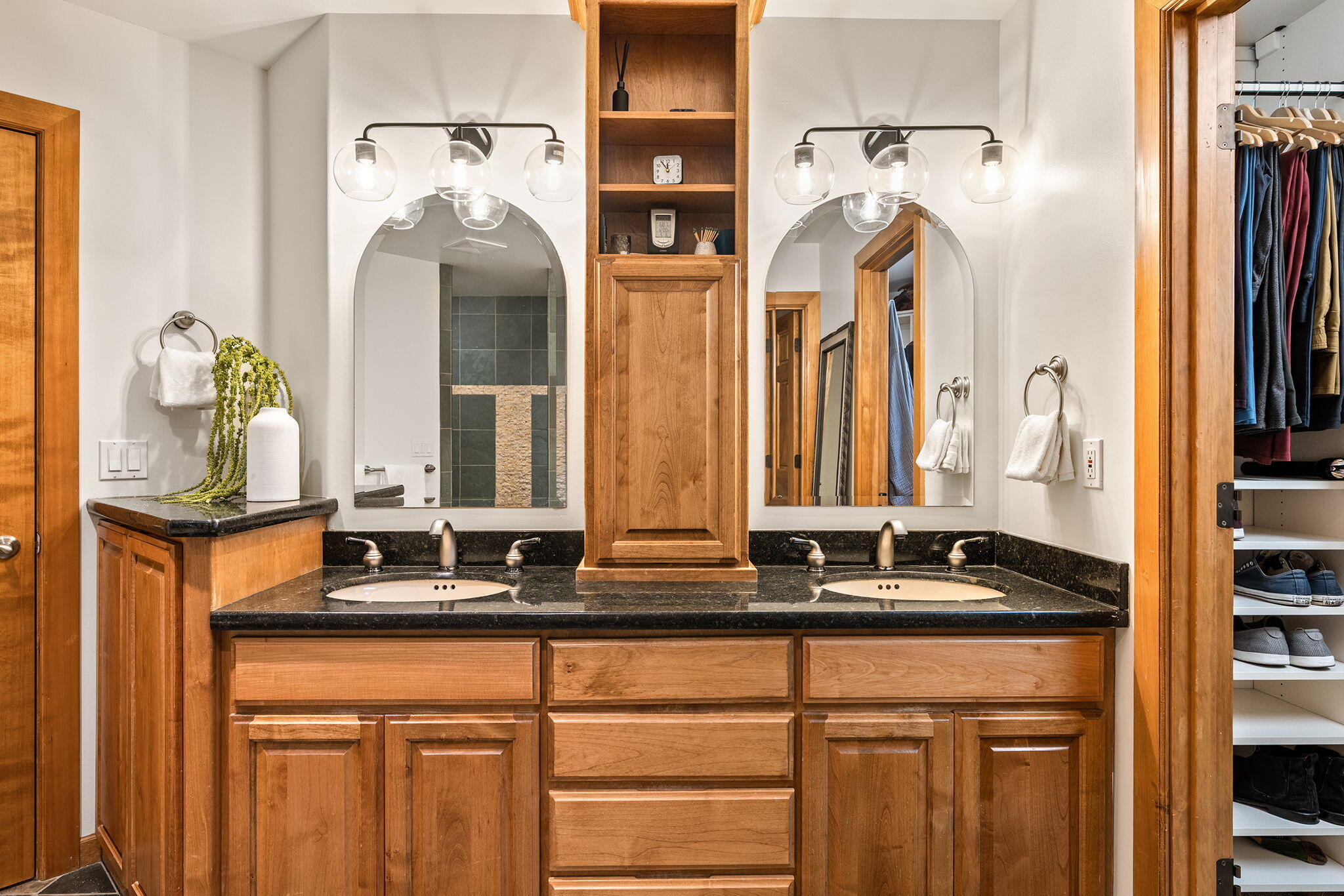 60766 Golf Village Loop Bend, OR 97702 - Photo 29 of 63 a bathroom with a sink and a mirror