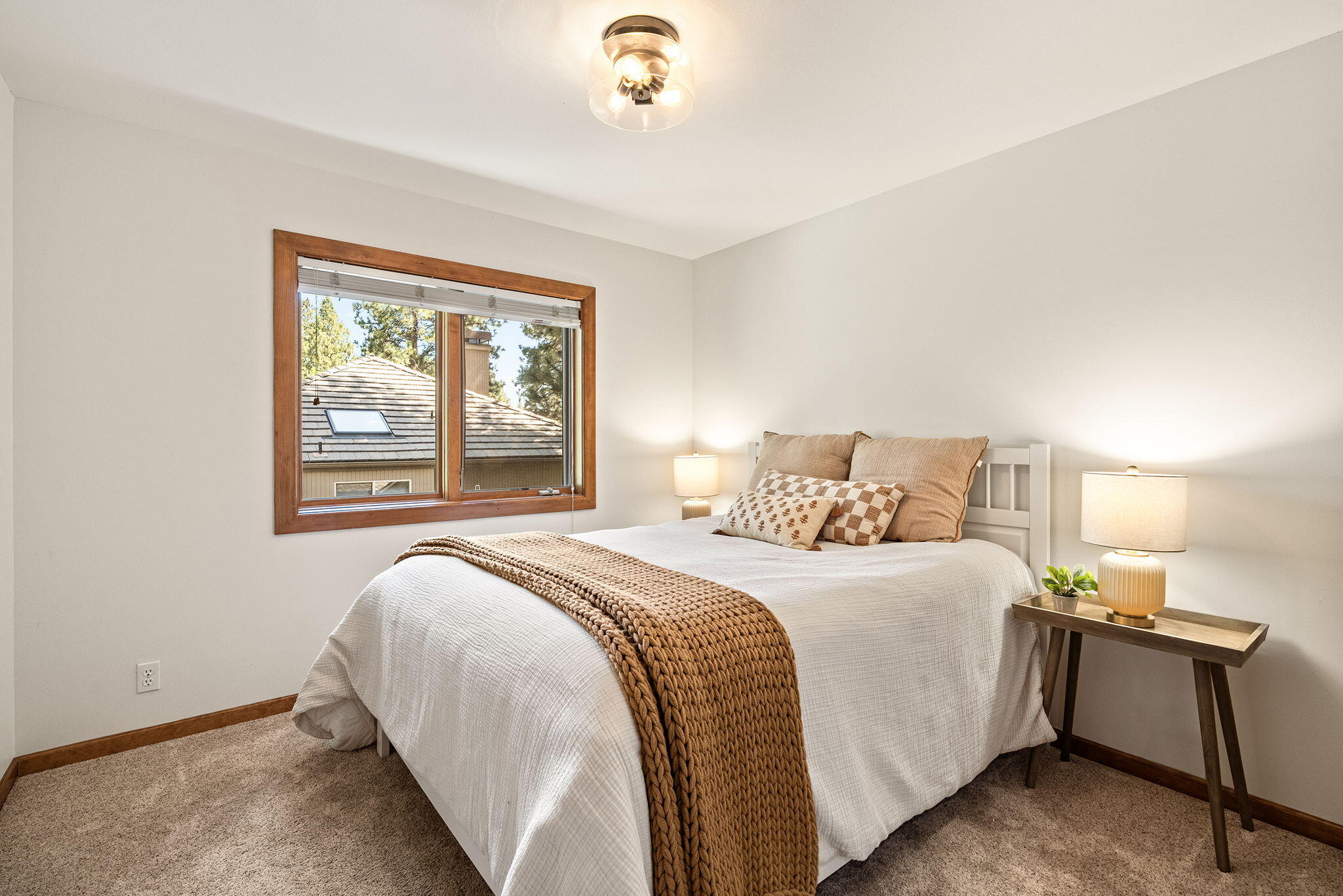 60766 Golf Village Loop Bend, OR 97702 - Photo 31 of 63 a bedroom with a bed and a window