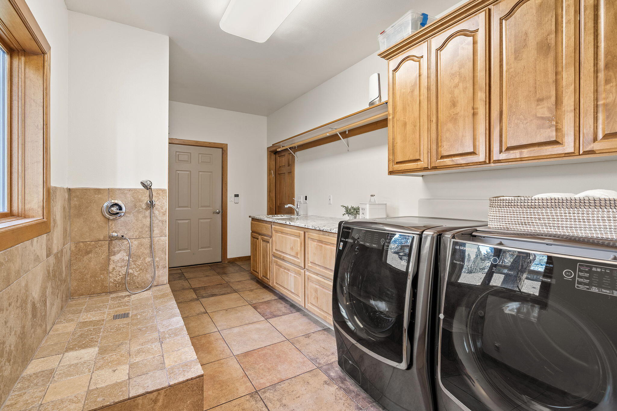 60766 Golf Village Loop Bend, OR 97702 - Photo 39 of 63 a utility room with dryer and washer