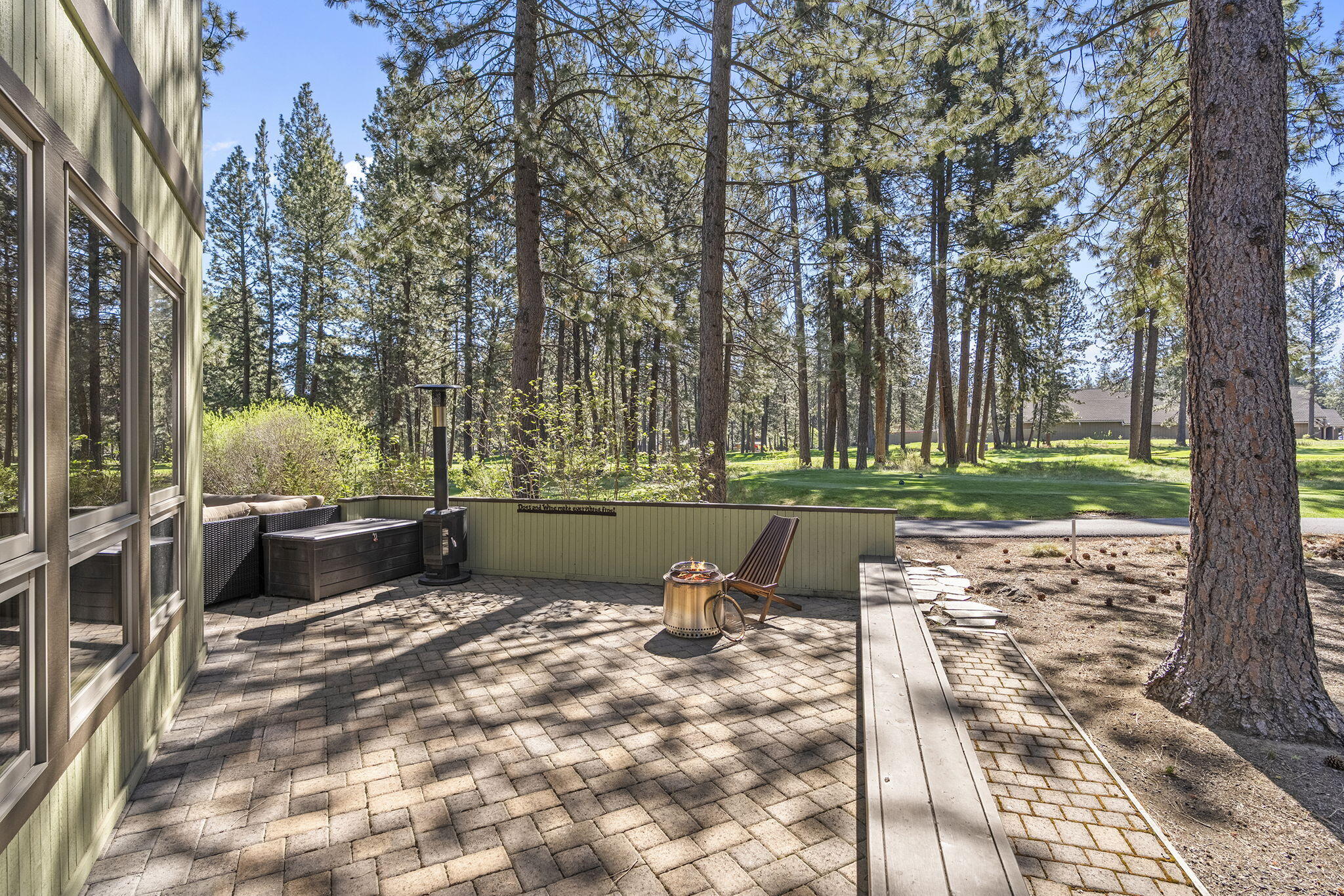 60766 Golf Village Loop Bend, OR 97702 - Photo 42 of 63 a view of a lake with a yard