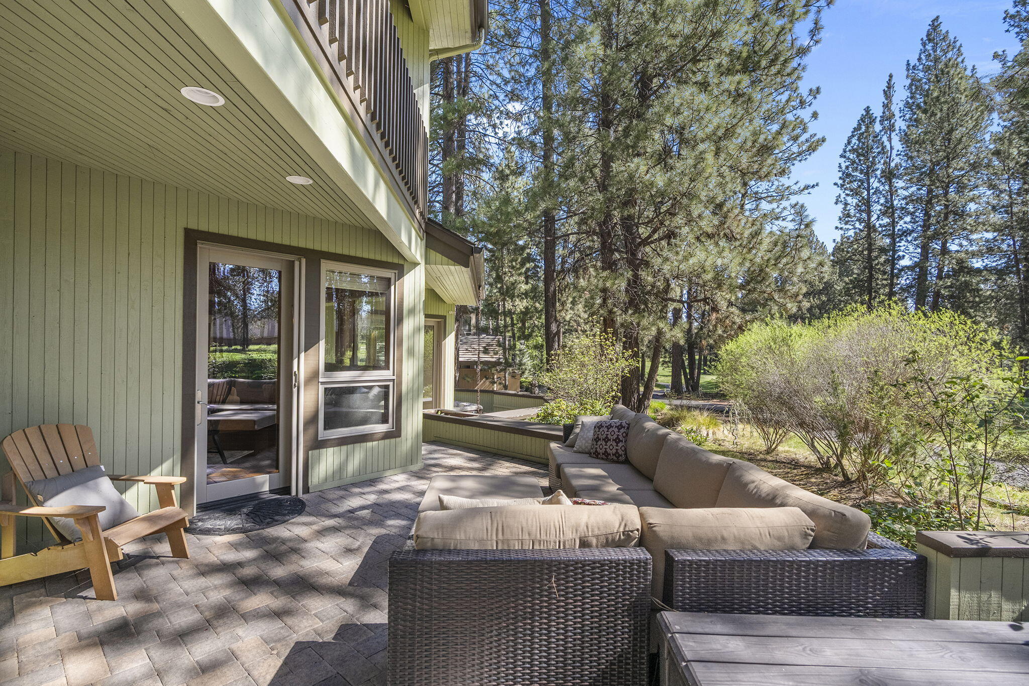 60766 Golf Village Loop Bend, OR 97702 - Photo 44 of 63 a outdoor living space with patio furniture and a fireplace