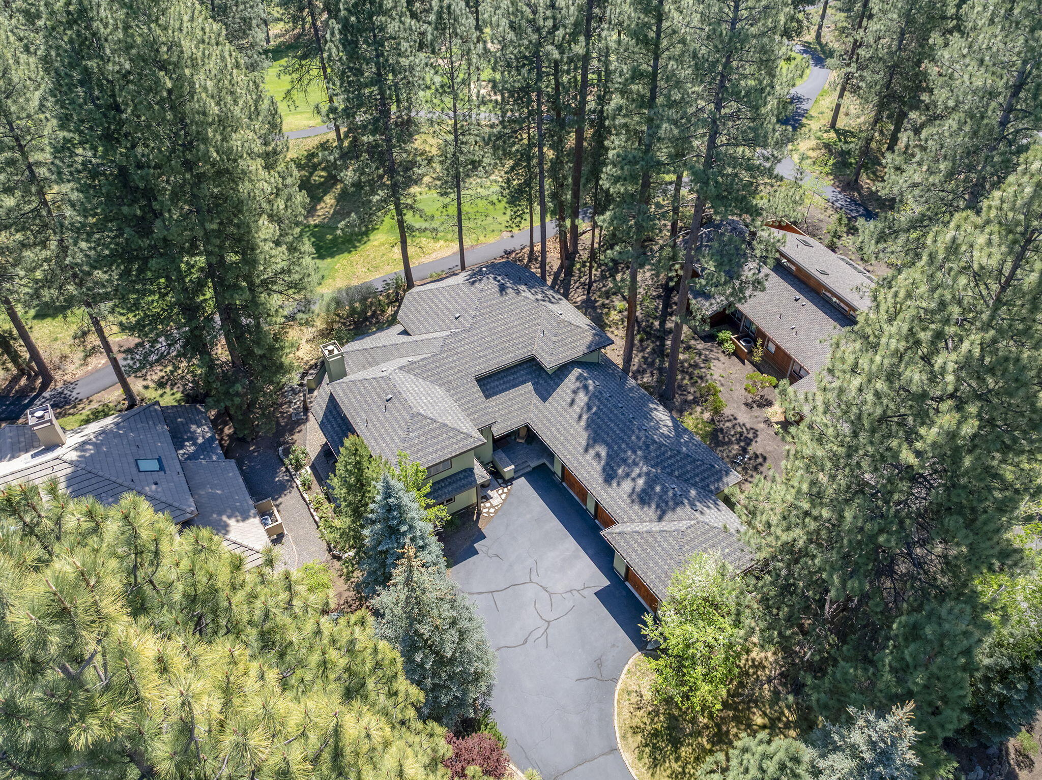 60766 Golf Village Loop Bend, OR 97702 - Photo 47 of 63 an aerial view of a house with yard and green space