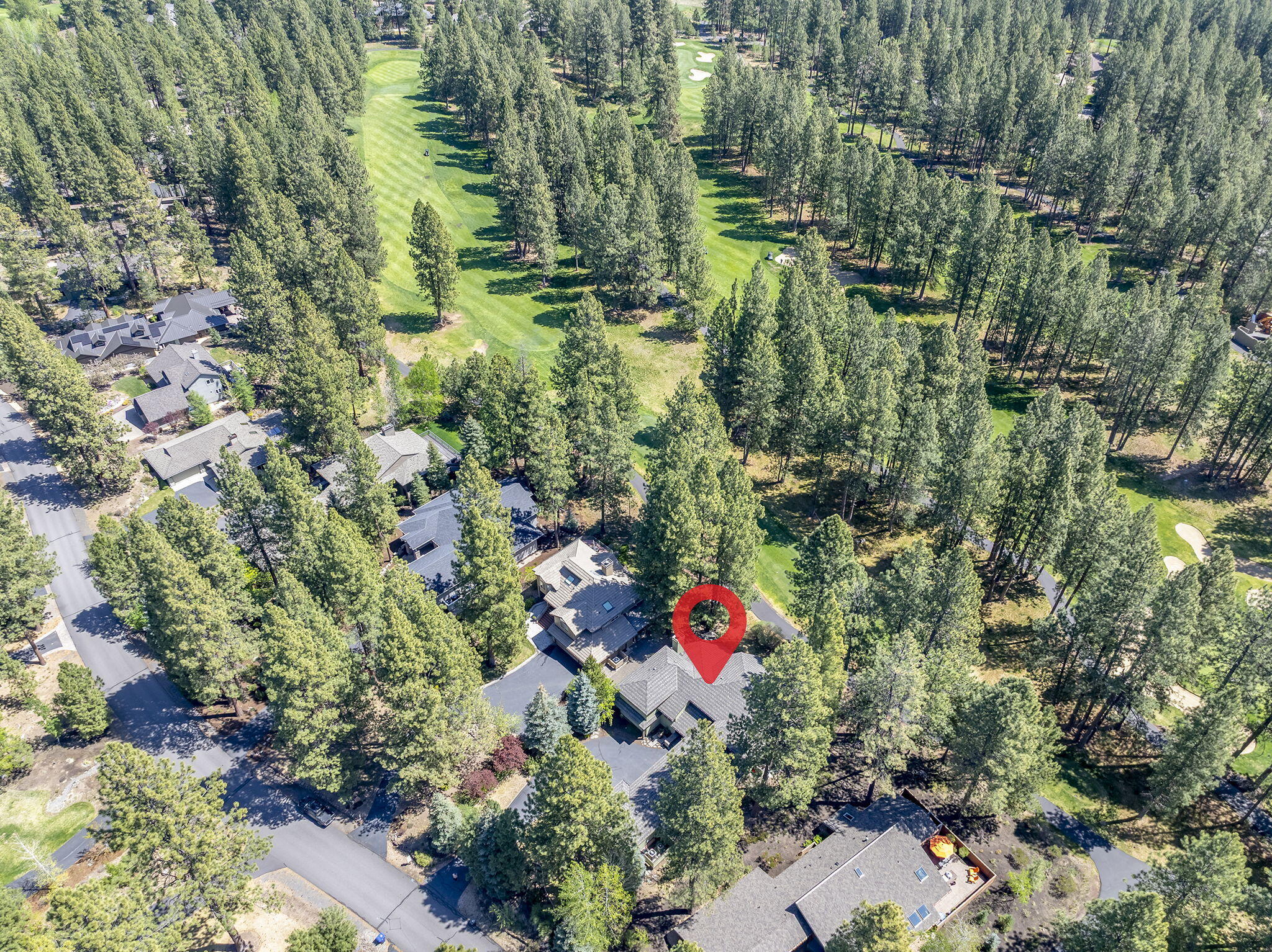 60766 Golf Village Loop Bend, OR 97702 - Photo 49 of 63 a aerial view of a house with lots of green space
