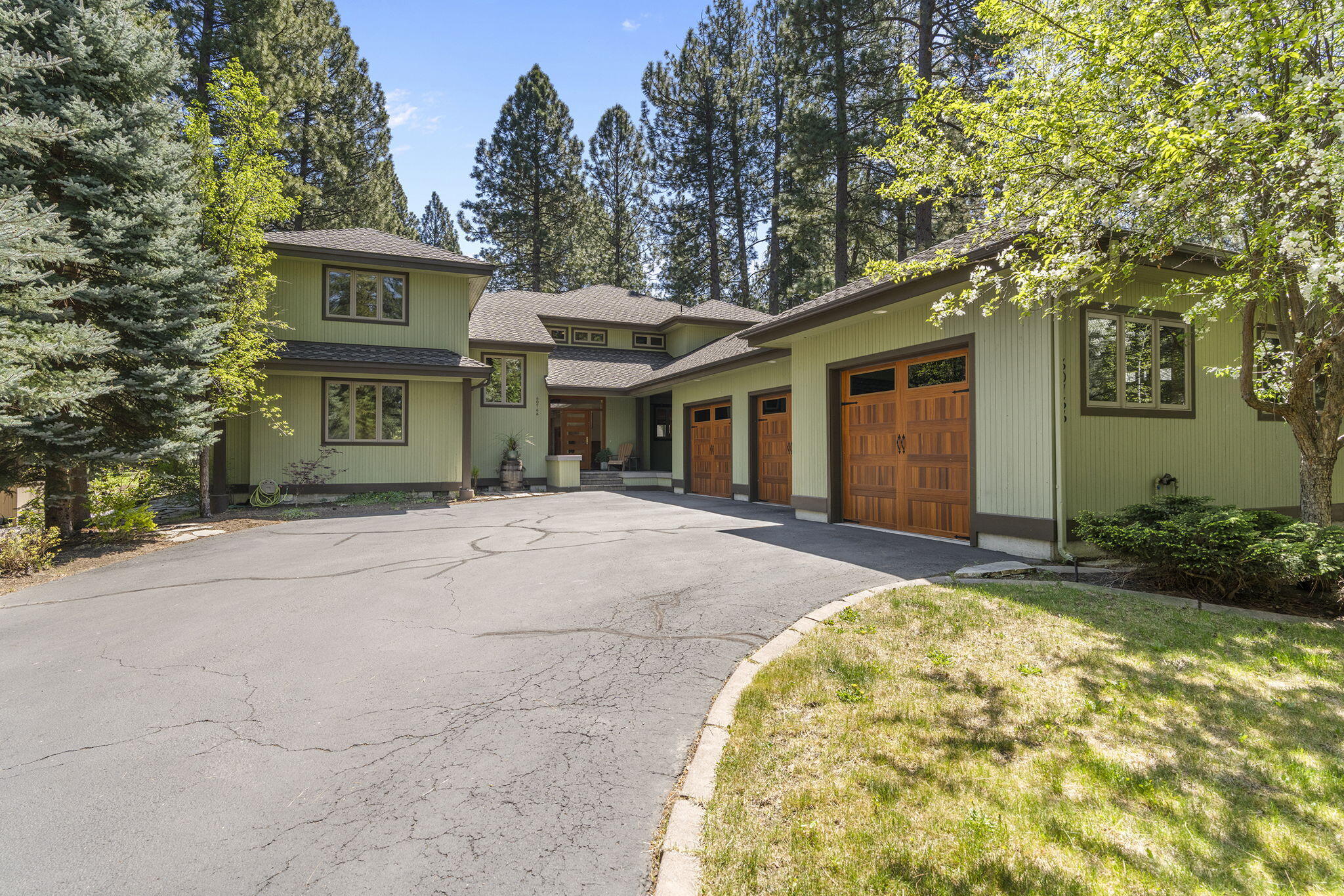 60766 Golf Village Loop Bend, OR 97702 - Photo 55 of 63 a front view of a house with garden
