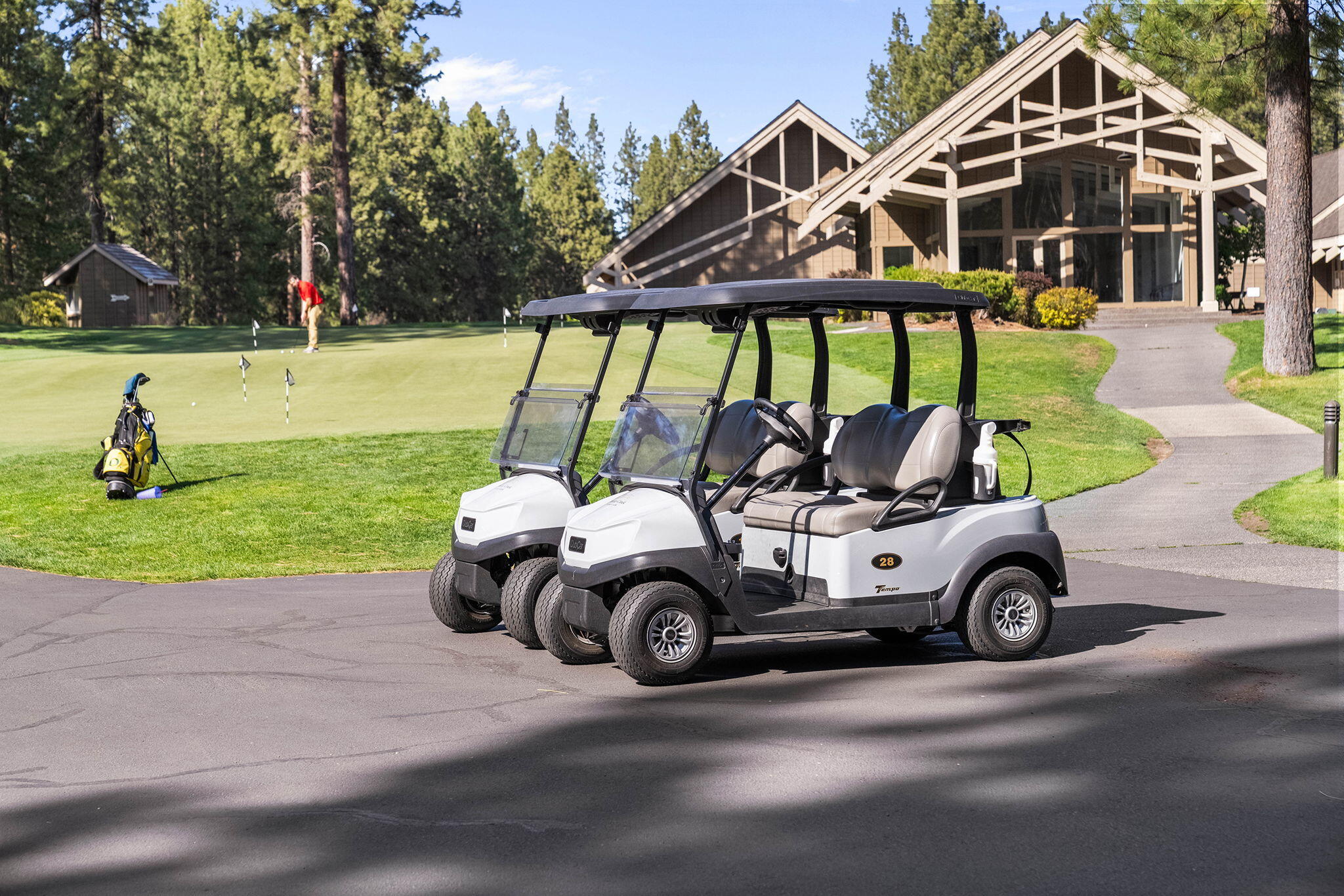 60766 Golf Village Loop Bend, OR 97702 - Photo 59 of 63 a car parked in front of a house with a yard