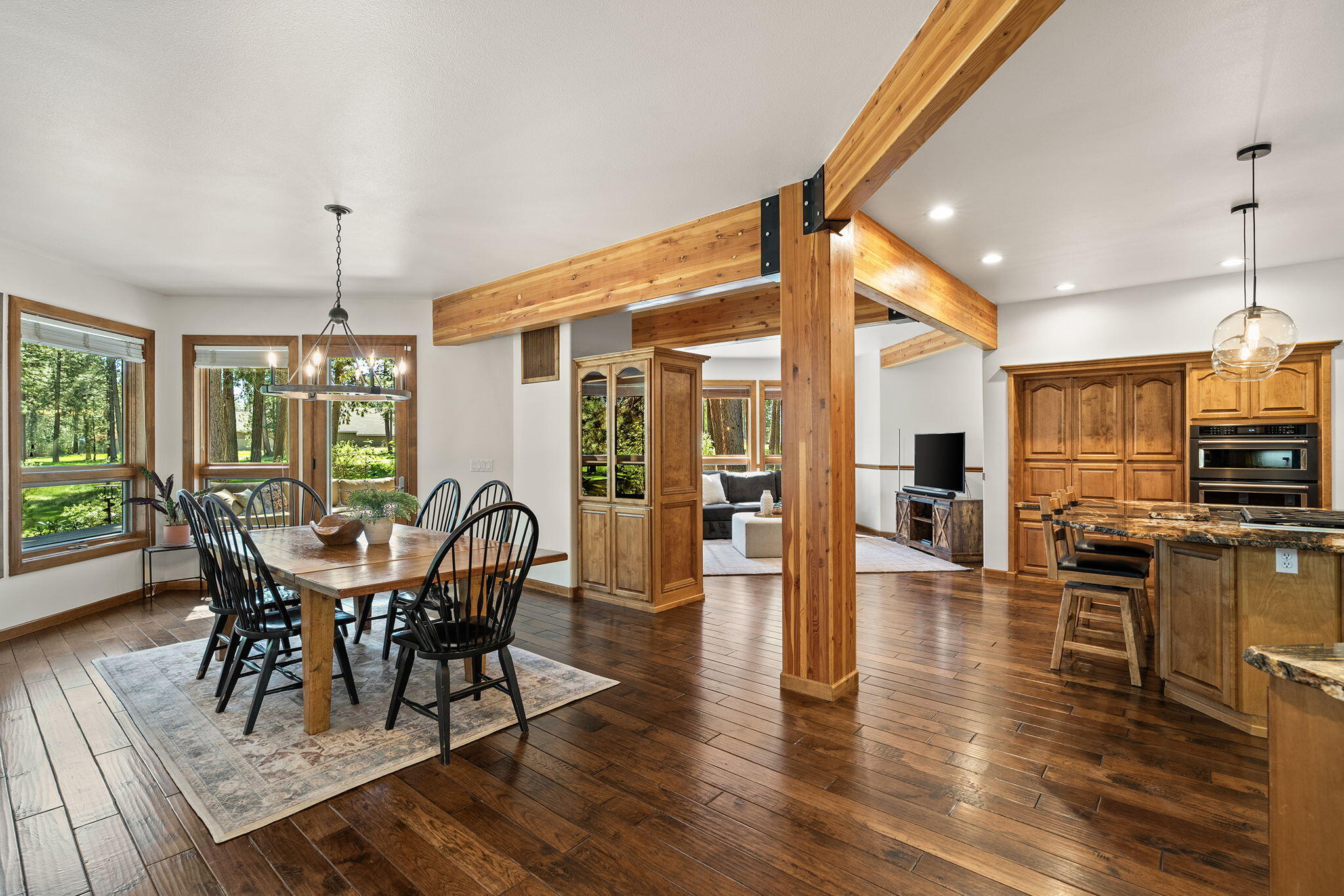 60766 Golf Village Loop Bend, OR 97702 - Photo 5 of 63 a view of a dining room with furniture window and wooden floor