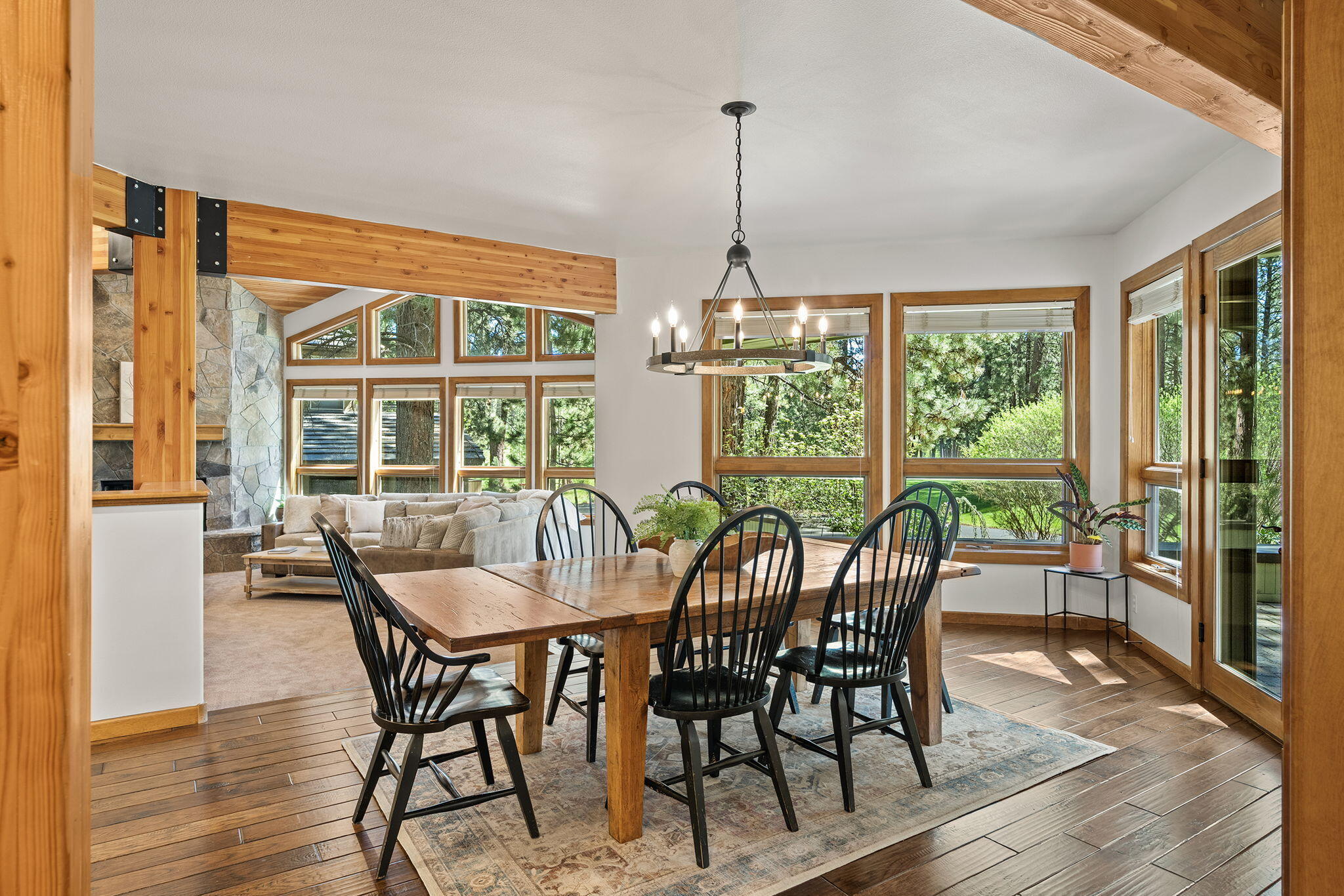 60766 Golf Village Loop Bend, OR 97702 - Photo 6 of 63 a view of a dining room with furniture window and wooden floor