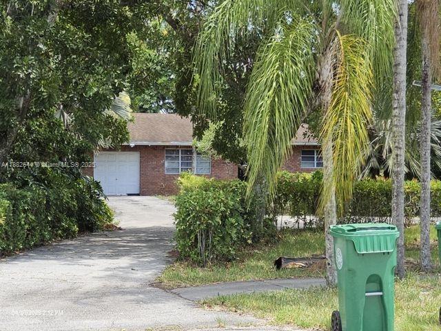 2150 Southwest 154th Avenue Davie, FL 33326 - Photo 4 of 6 front view of a house with a yard