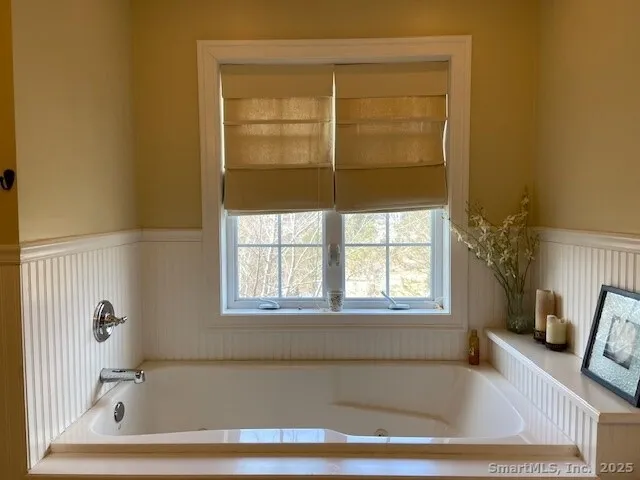 a bath tub sitting next to a window