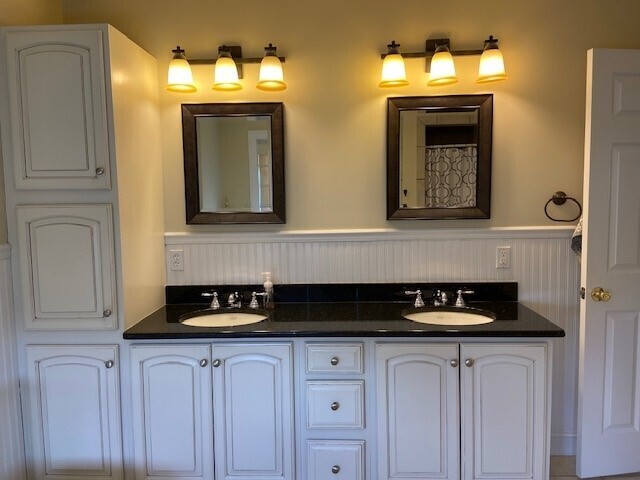 432 Quassapaug Road Woodbury, CT 06798 - Photo 12 of 21 a bathroom with a sink and a mirror