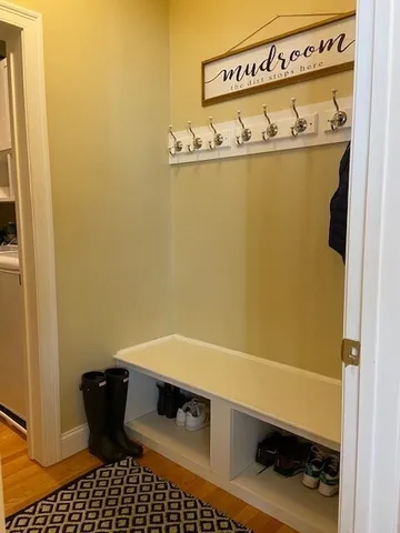 a bathroom with a toilet a sink and a mirror