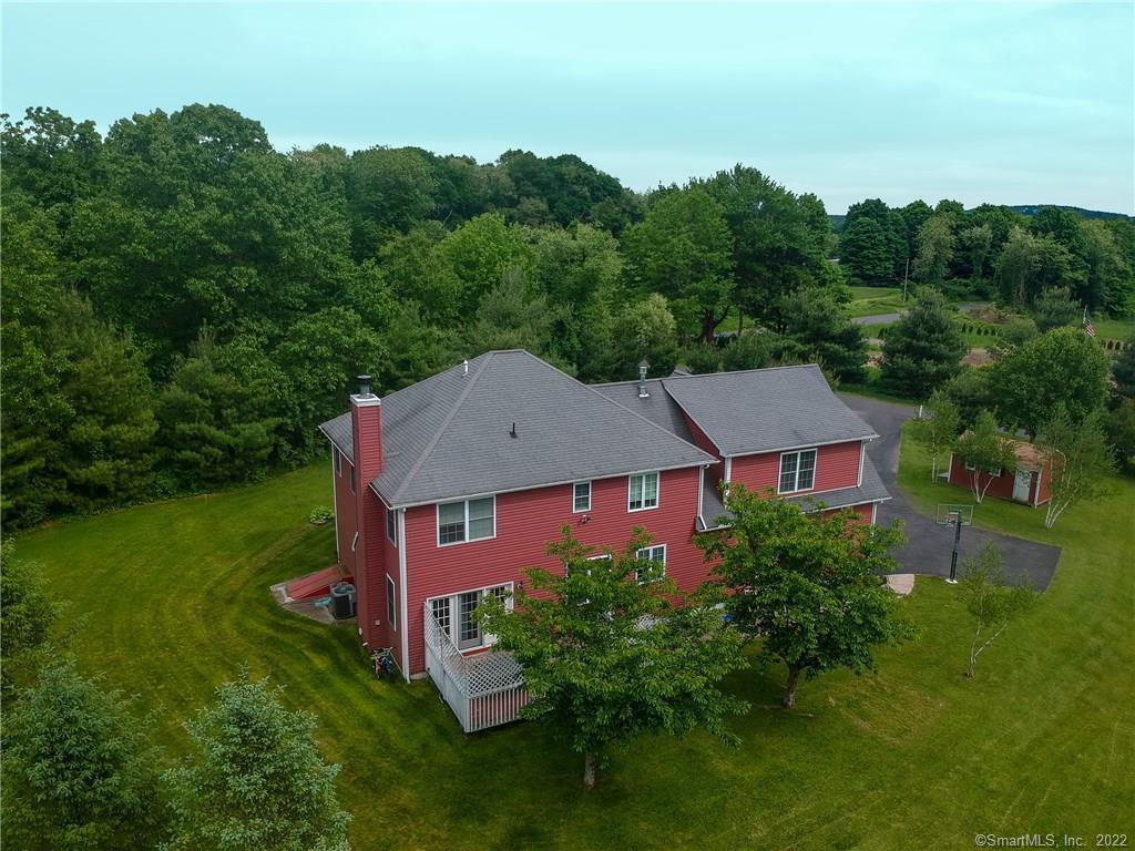 432 Quassapaug Road Woodbury, CT 06798 - Photo 2 of 21 an aerial view of a house with yard and outdoor seating
