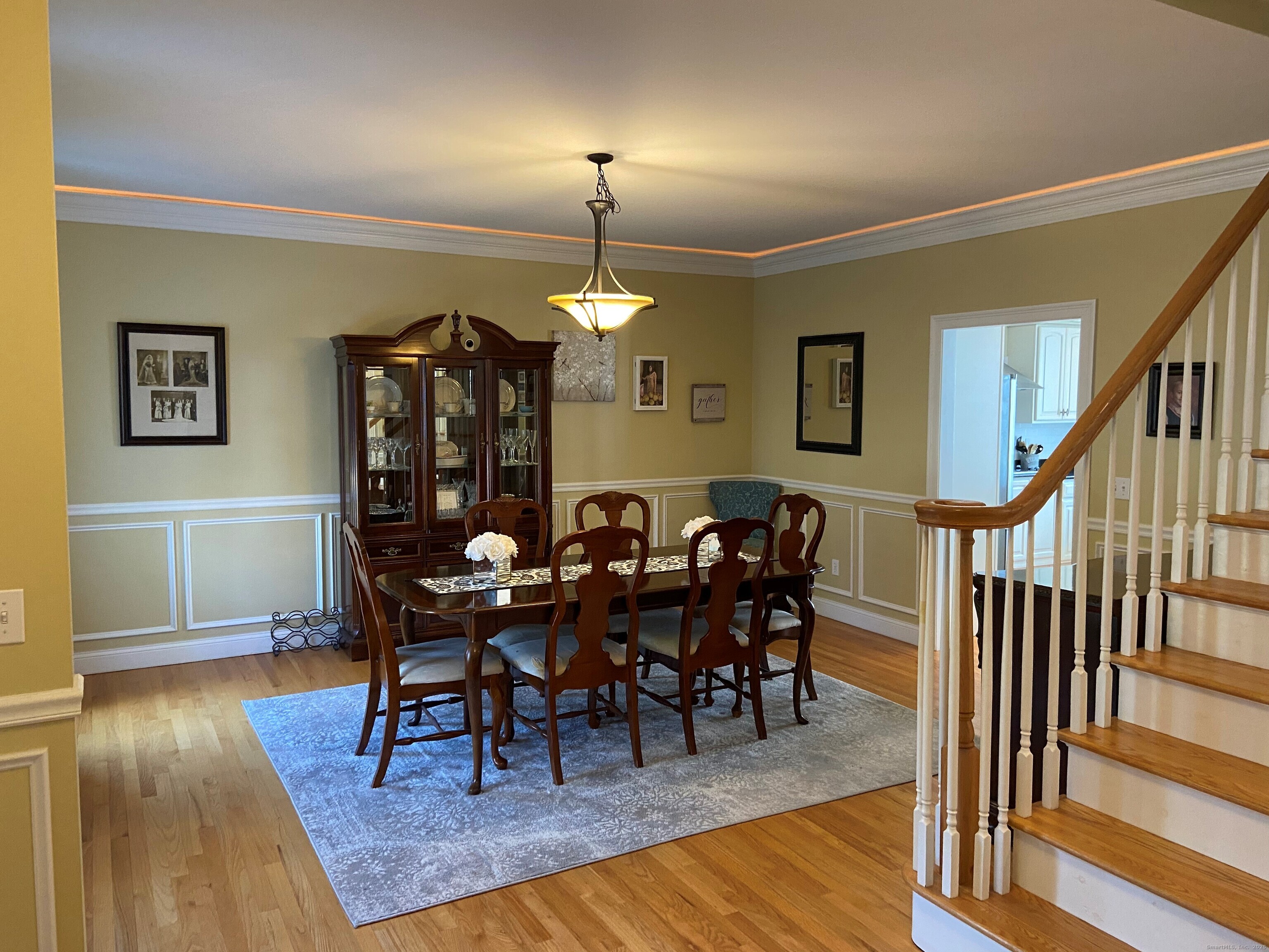 432 Quassapaug Road Woodbury, CT 06798 - Photo 4 of 21 a view of a dining room with furniture and wooden floor