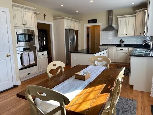 a living room with furniture and kitchen view