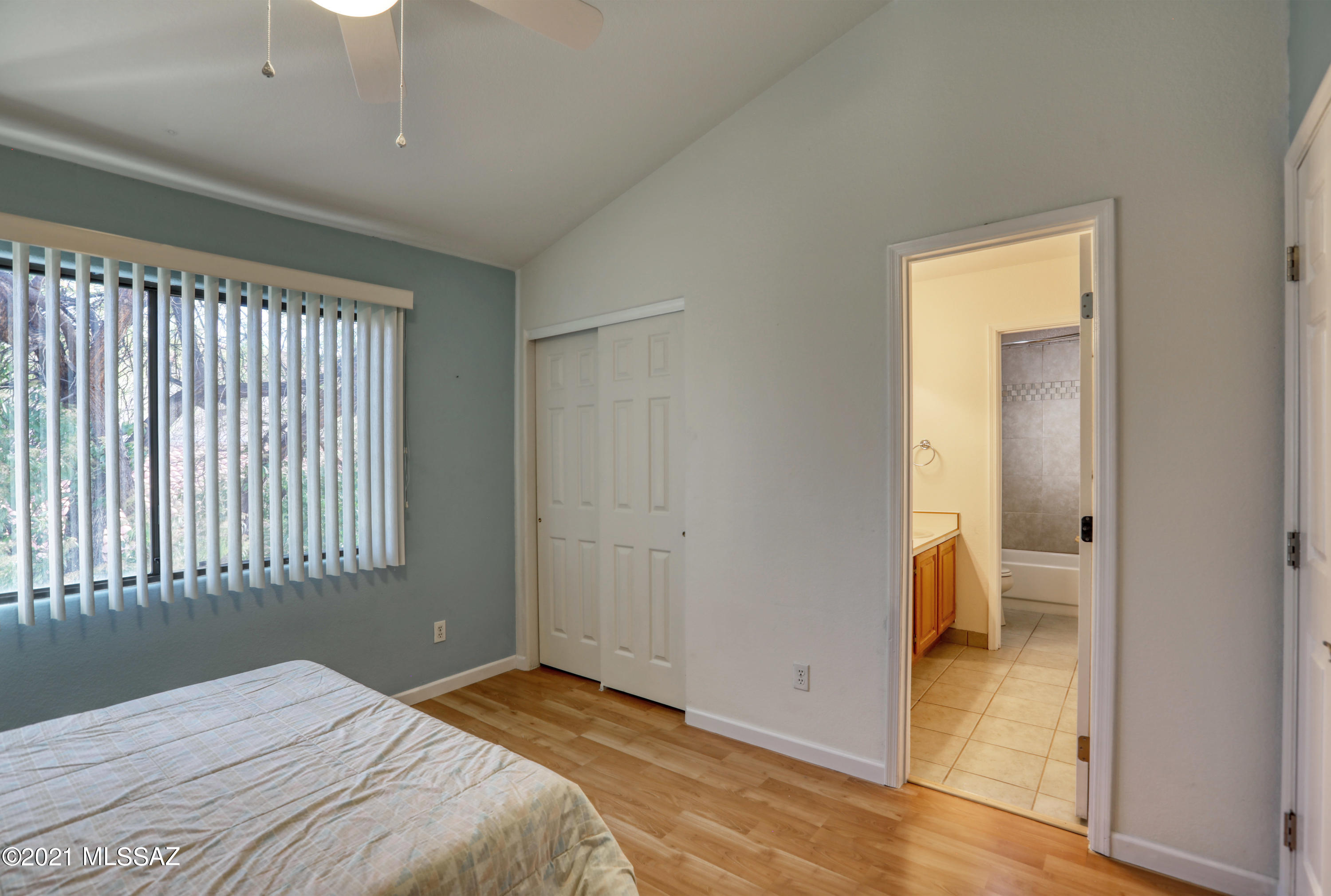 12560 North Wayfarer Way Oro Valley, AZ 85755 - Photo 36 of 43 a bedroom with a bed and a window