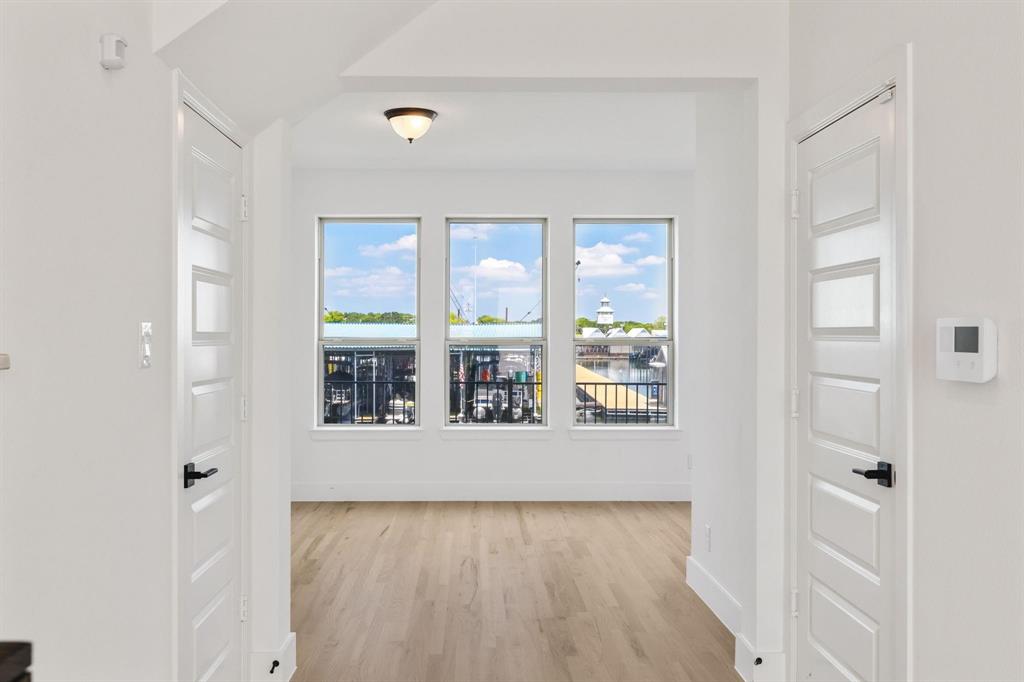 9303 Easy Street Rowlett, TX 75088 - Photo 23 of 33 wooden floor in an empty room with a window