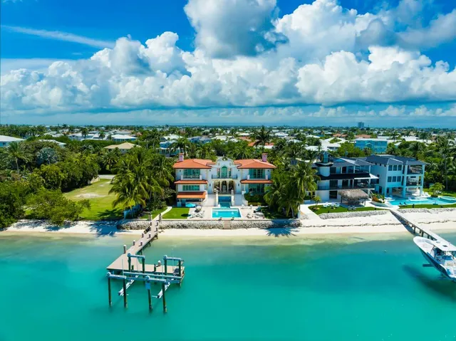 a view of swimming pool with outdoor seating and city view