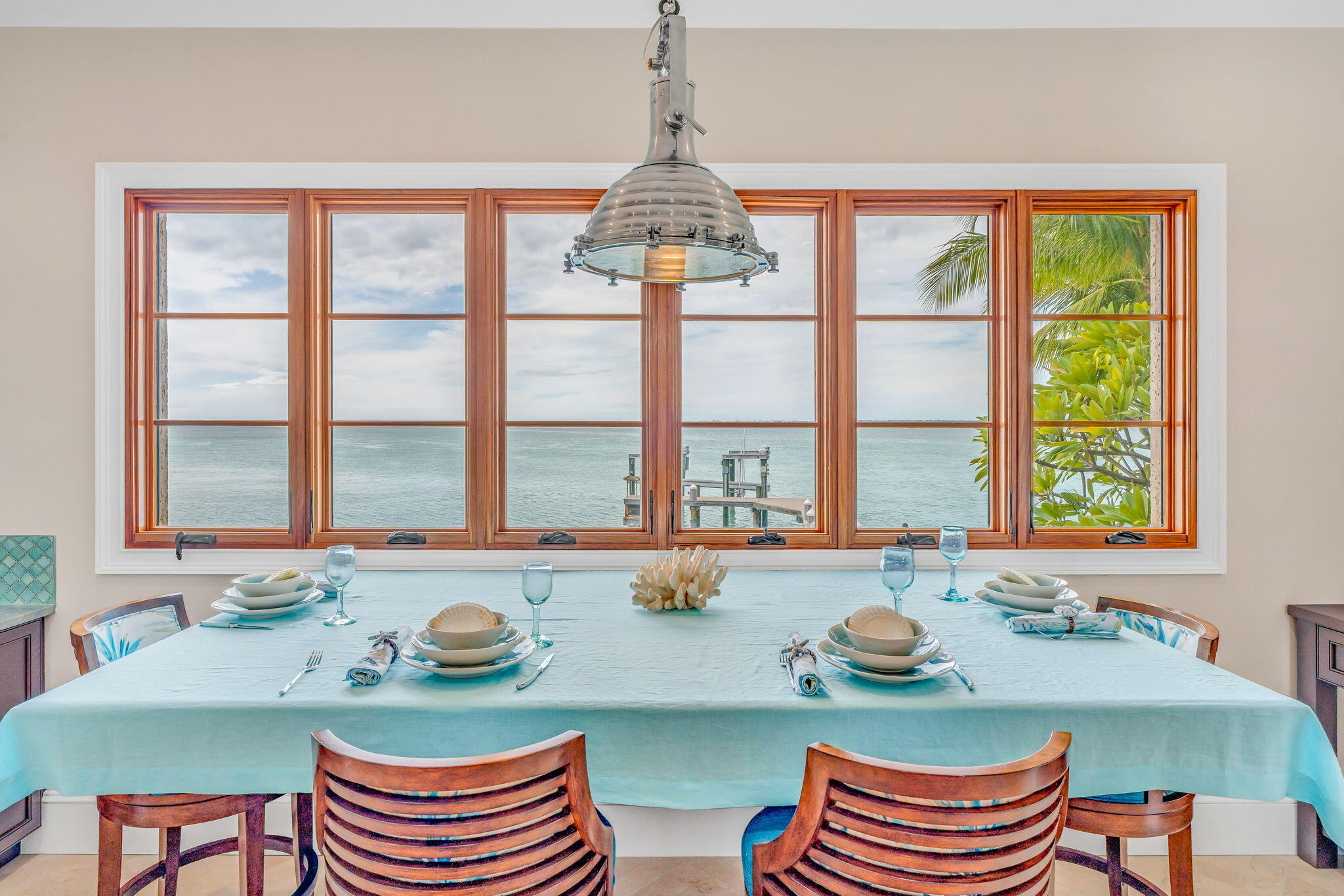 205 15th Circle Key Colony Beach, FL 33051 - Photo 22 of 101 a dining room with furniture a chandelier and wooden floor
