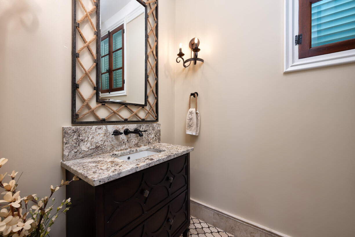 205 15th Circle Key Colony Beach, FL 33051 - Photo 61 of 101 a bathroom with a sink and a mirror