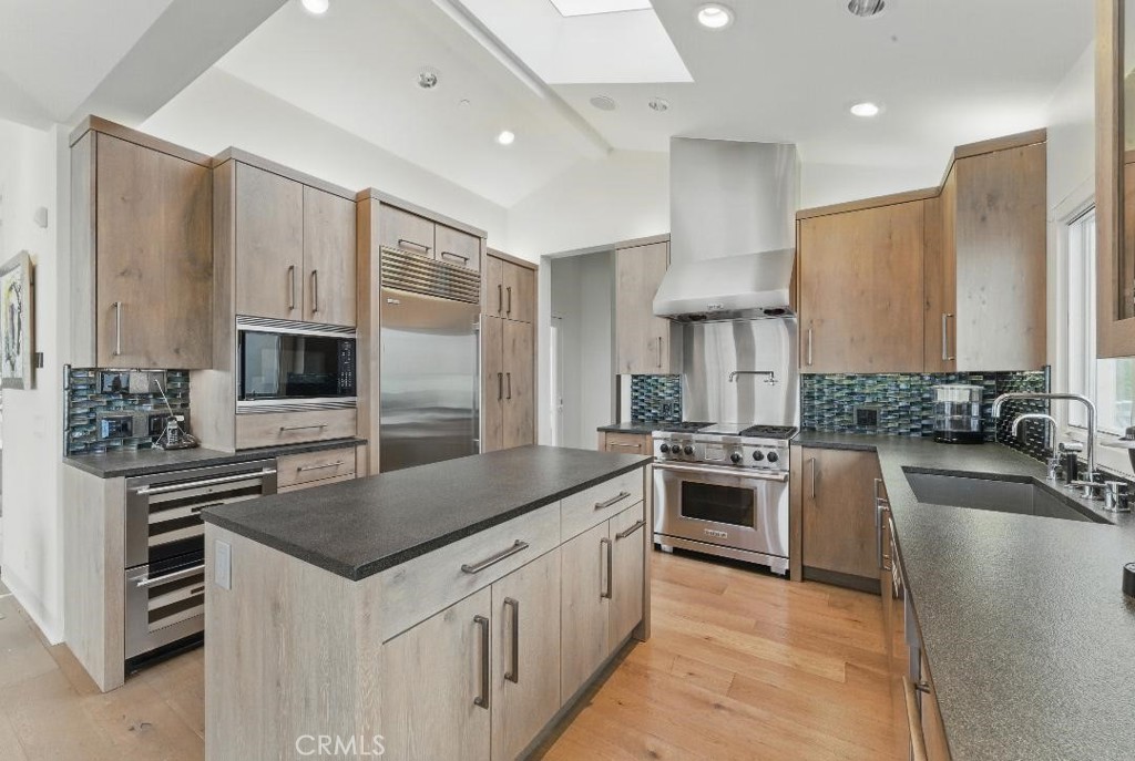 2501 Barrymore Drive Malibu, CA 90265 - Photo 13 of 54 a kitchen with stainless steel appliances granite countertop a sink stove and refrigerator