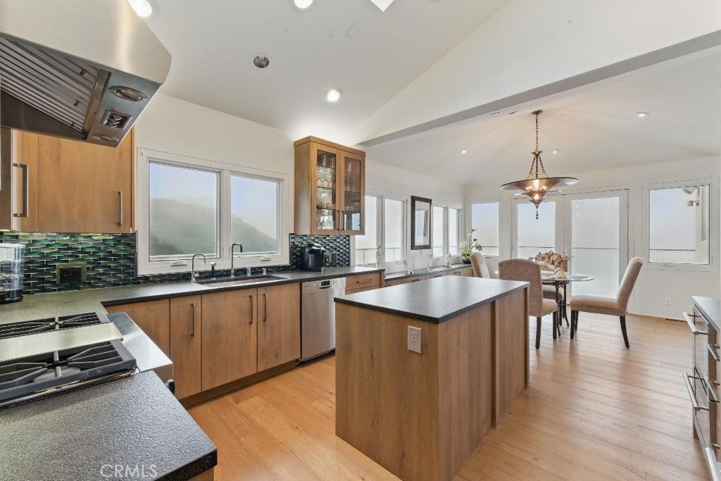 2501 Barrymore Drive Malibu, CA 90265 - Photo 15 of 54 a large kitchen with kitchen island a sink table and chairs