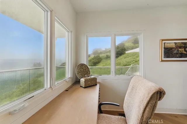 a bedroom with a bed and chair