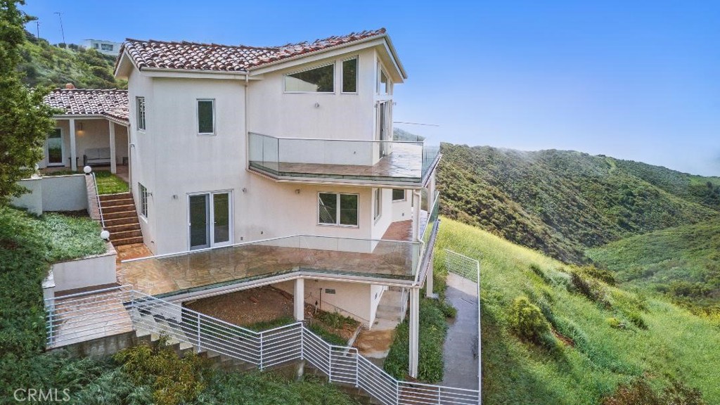 2501 Barrymore Drive Malibu, CA 90265 - Photo 2 of 54 a front view of a house with balcony