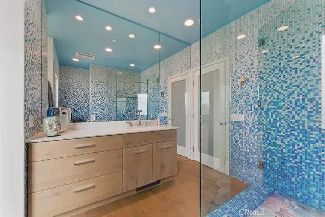 a bathroom with a toilet and a shower curtain