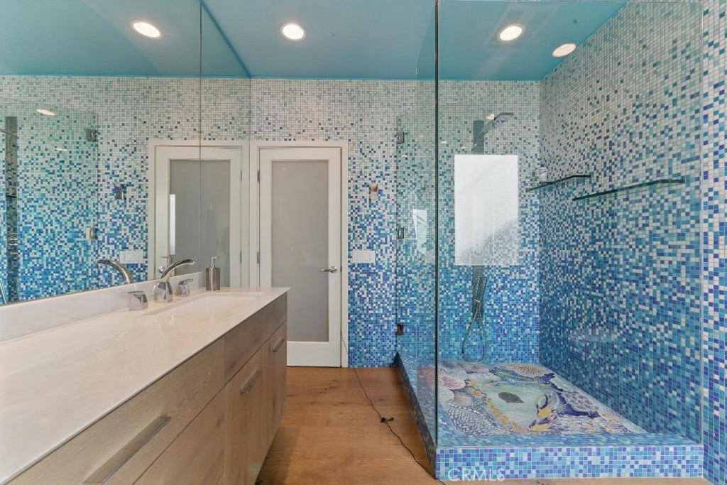 2501 Barrymore Drive Malibu, CA 90265 - Photo 25 of 54 a bathroom with a sink a toilet and shower