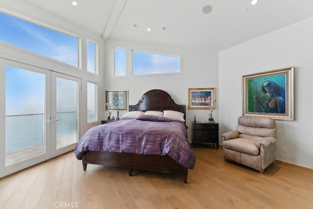 2501 Barrymore Drive Malibu, CA 90265 - Photo 31 of 54 a bedroom with a bed and wooden floor