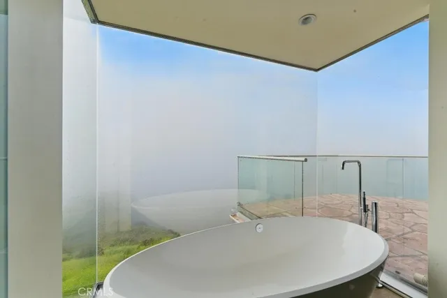 a room with sink and large window