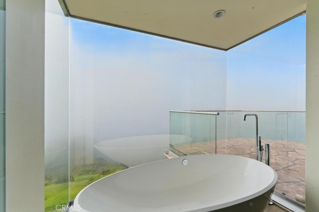 2501 Barrymore Drive Malibu, CA 90265 - Photo 39 of 54 a bathroom with a sink and a mirror