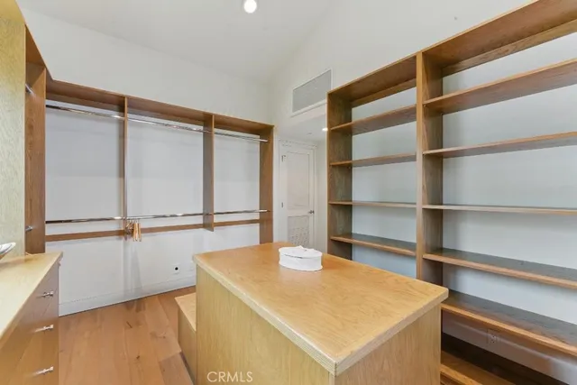 a room with a walk in closet and a window