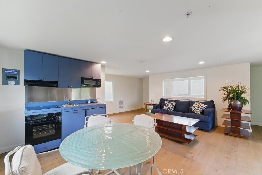 2501 Barrymore Drive Malibu, CA 90265 - Photo 46 of 54 a living room with furniture and a wooden floor