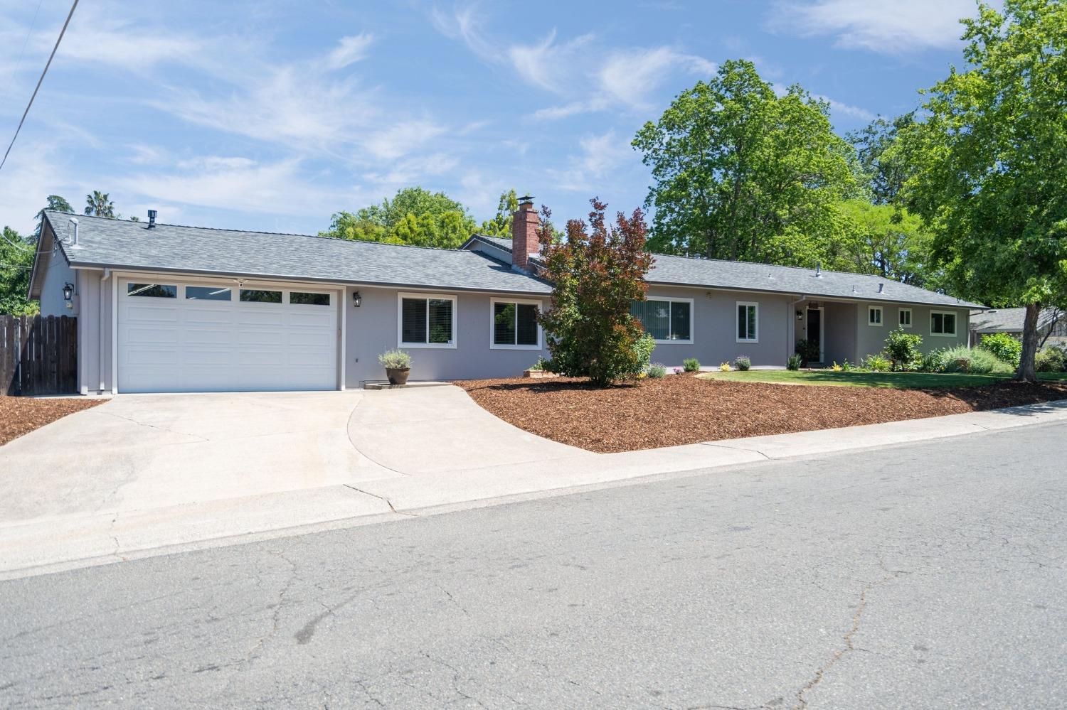 5100 Arbardee Drive Fair Oaks, CA 95628 - Photo 1 of 1 a front view of a house with a yard and garage