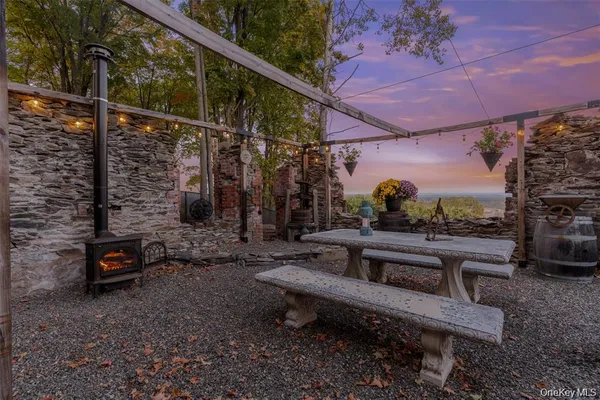 a view of a patio with a table and chairs
