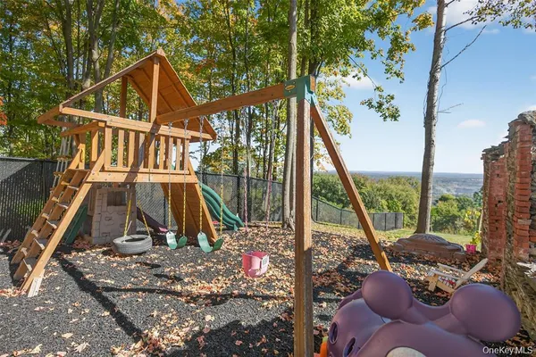 a view of a house with backyard porch and sitting area