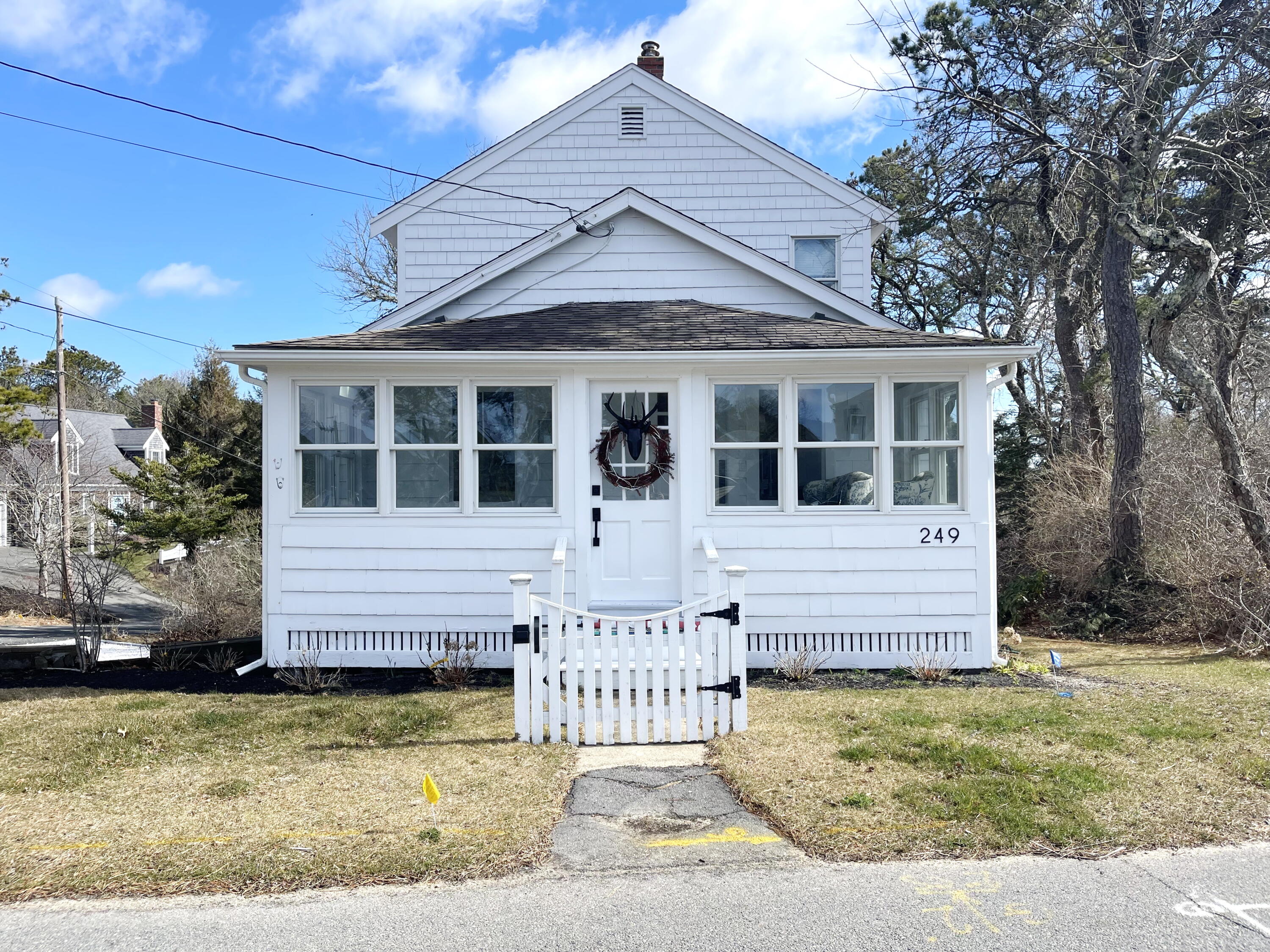 249 Ridgevale Road Chatham, MA 02633 - Photo 1 of 34 a front view of a house with a garden