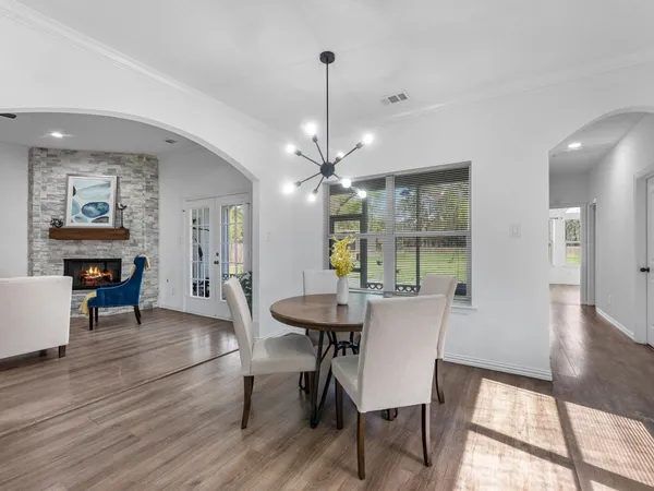 a spacious bathroom with a double vanity sink mirror and shower