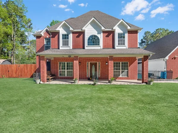 a view of a house with a big yard