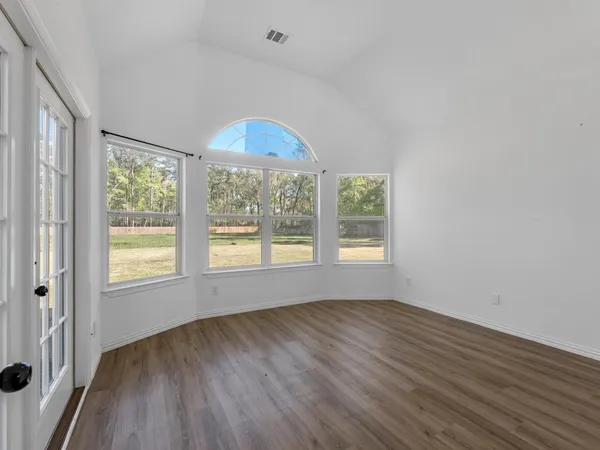 a view of cabinets and wooden floor